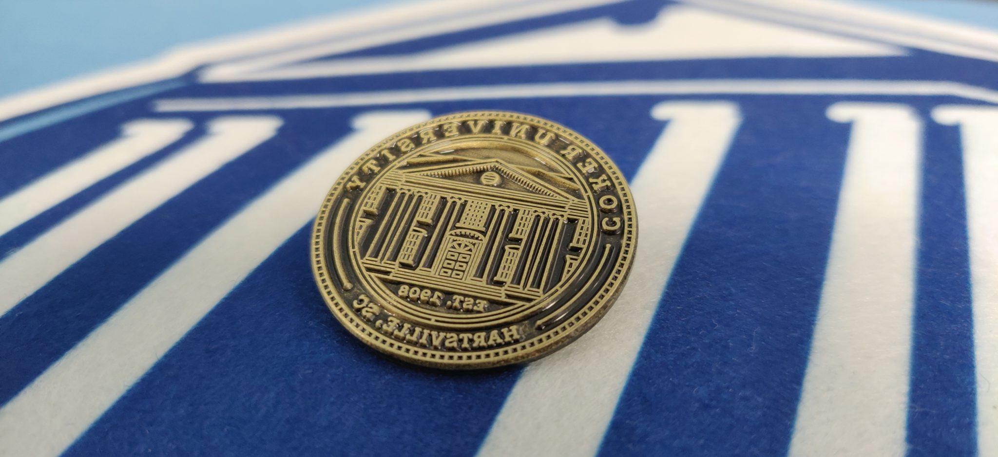 Coker University Seal on a lapel pin
